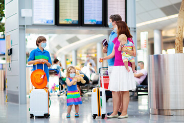 Wall Mural - Family in airport in face mask. Virus outbreak.