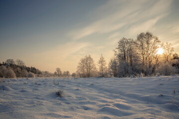 Beautiful snowy winter landscape panorama with sun.