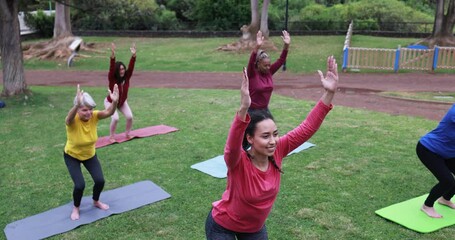 Wall Mural - People doing yoga class at city park - Healthy lifestyle and sport concept