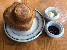 High Angle View Of Popover With Butter And Jam On Table