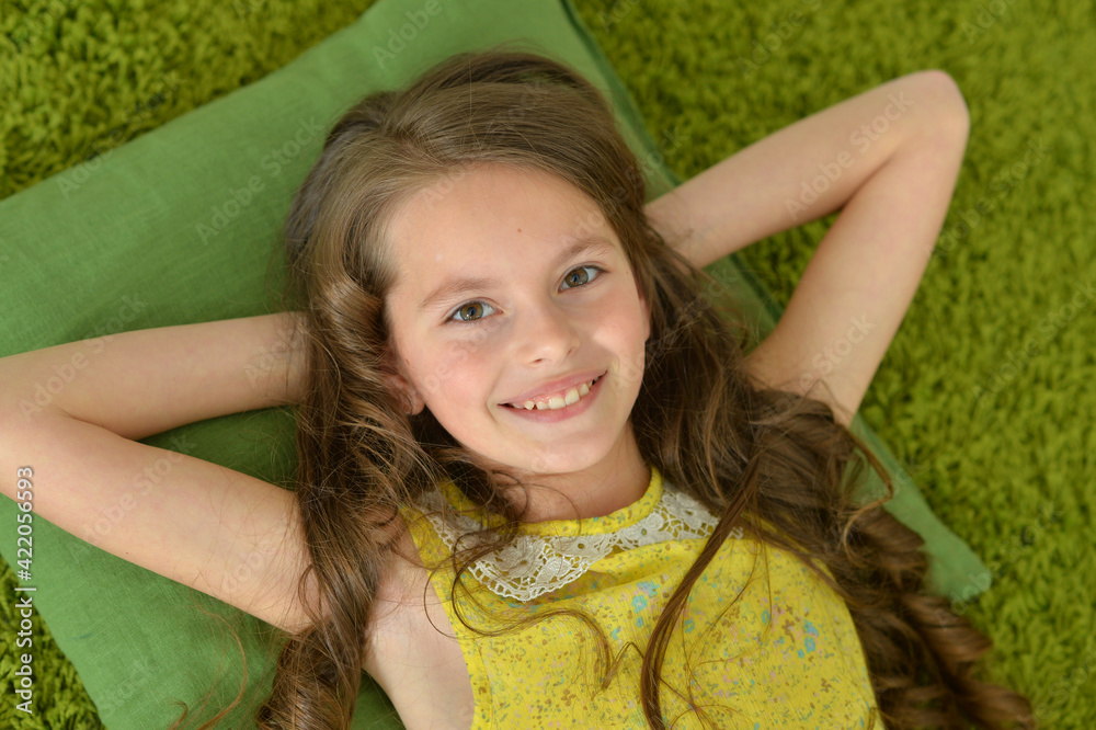 Portrait of beautiful teen girl lying on floor in room Stock Photo ...