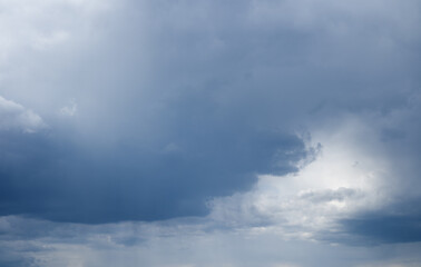 Wall Mural - majestic rain clouds and light through their.