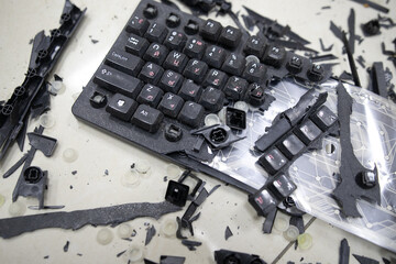 broken keyboard. destroyed keyboard. an image of computer frustration.