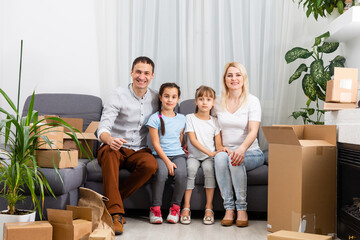 Wall Mural - Portrait of a happy family smiling at home