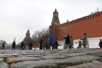 Moscow, Russia - May 10, 2015: Tourists walk on Red Square in Moscow. Red Square, the main square of Moscow, located in the center of the radial-circular layout of the city