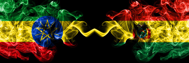 Ethiopia, Ethiopian vs Bolivia, Bolivian smoky mystic flags placed side by side. Thick colored silky abstract smoke flags.