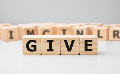 Poster - Word GIVE made with wood building blocks