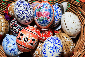 Close-up of easter eggs in a wicker basket.