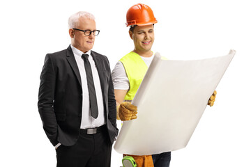 Wall Mural - Construction worker showing a plan to a mature businessman