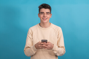 Poster - teenager boy or student with mobile phone isolated on background