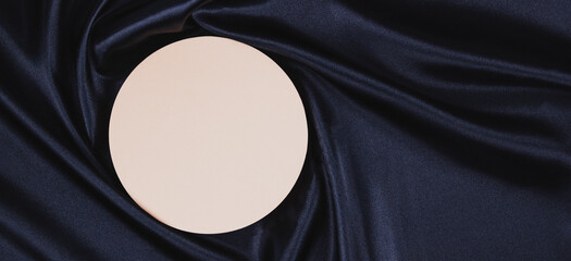 Wall Mural - Pastel circle platform podium on black color background with drapery and wavy folds of silk satin material