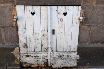 Wall Mural - A window with shutters on the street of Saint-Pourcain-sur-Sioule city, France