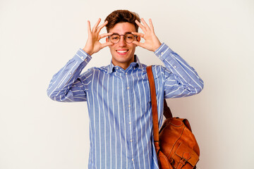 Young student man isolated on white background showing okay sign over eyes