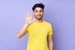 © luismolinero - Arabian handsome man over isolated background counting five with fingers
