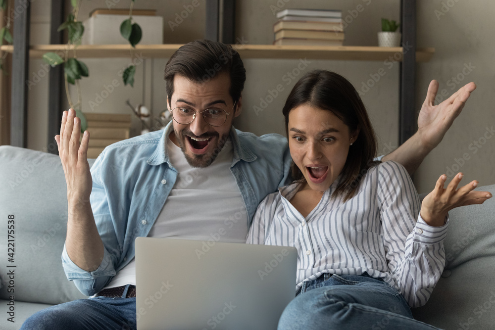 Close up overjoyed young couple looking at laptop screen, reading unexpected good news, celebrating success, online lottery win, money refund, excited wife and husband received good news in email - obrazy, fototapety, plakaty 