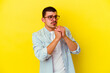 © Asier - Young caucasian cool man isolated on yellow background scared and afraid.
