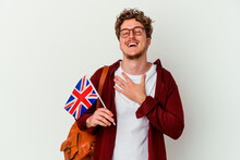 Young Student Man Learning English Isolated On White Background Laughs Out Loudly Keeping Hand On Chest.