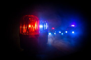 Wall Mural - Police car blue and red round vintage siren in dark. Rotating retro style police siren in dark.