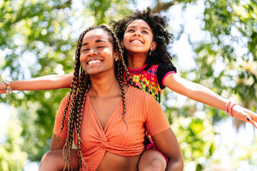 Wall Mural - Mother and daughter enjoying a day at the park.