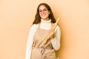 Wall Mural - Young caucasian chef woman isolated happy, smiling and cheerful.