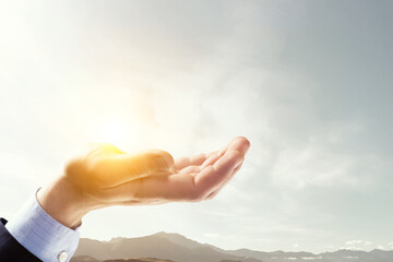 Wall Mural - Sky and clouds in human hand