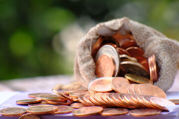 Poster - Stacks of gold money coin on table background and concept saving money, business growth strategy of money concept, advertising coins of finance and banking