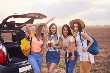 Sticker - Happy young women taking selfie near car