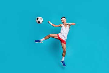 Sticker - Full size portrait of young guy open mouth shout jumping leg kick ball wear long socks isolated on blue color background