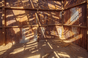 Interior of a building with corrugated iron walls in the abandoned historic Santa Laura saltpeter plant in the north of Chile