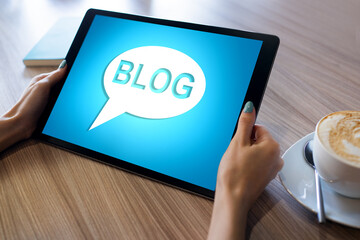 Wall Mural - tablet with blog text the on screen. social network, communication and internet marketing concept