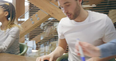 Wall Mural - Diverse young businesspeople 
working it an office table
