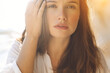 © nuzza11 - Portrait of a beautiful girl close-up, the wind flutters her hair, the sunset by the ocean. High quality photo.