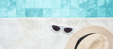 White Sunglasses And Hat Near Swimming Pool In Luxury Hotel. Summer Travel, Vacation, Holiday And Weekend Concept