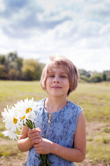 Russian pre-teen in   summer meadow in   field