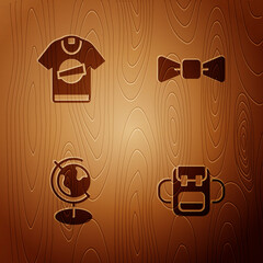 Sticker - Set School backpack, T-shirt, Earth globe and Bow tie on wooden background. Vector