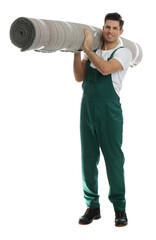 Wall Mural - Male worker with rolled carpet on white background