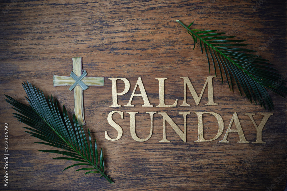 Palm sunday background. Cross and palm on wooden background. - obrazy, fototapety, plakaty 