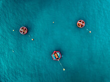 Aerial View Of Blue Sea Surface With Buoys
