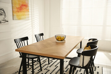 Wall Mural - Stylish wooden dining table and chairs in room. Interior design