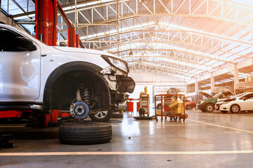 car in automobile repair service center with soft-focus and over light in the background