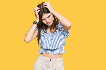 Sticker - Young beautiful caucasian girl wearing casual clothes suffering from headache desperate and stressed because pain and migraine. hands on head.