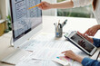 © DragonImages - Cropped image of UX and UI designers working on version of website for mobile devices