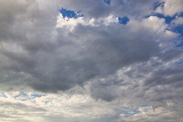 Wall Mural - dramatic blue sky with rays and white clouds