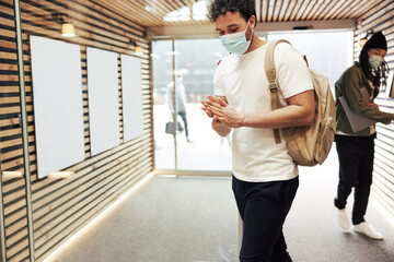 Wall Mural - Diverse young businesspeople sanitizing their hands at work