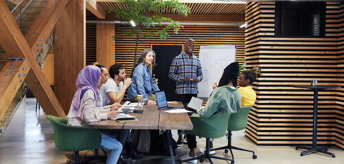 Wall Mural - Smiling group of diverse businesspeople meeting at work