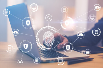 Aufkleber - Smart technologies and biometrics concept with digital fingerprint and protection icons at laptop wih man hand background