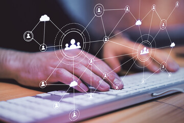 Poster - Corporate networking concept with digital screen with application icons and man hand typing on computer keyboard