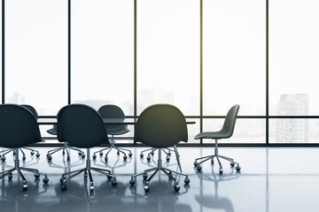 Stylish spacious meeting room with black chairs and table on glossy floor and big window with smoky city view