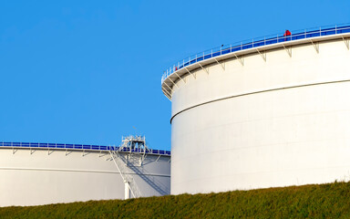 Large petrol storage tanks at a petrochemical plant.