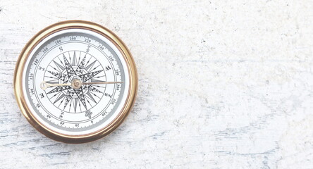 Wall Mural - classic navigation compass on natural background as symbol of tourism with compass, travel with comp